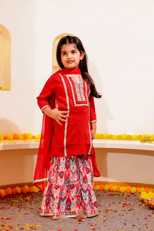 Gulnaar Grace - Girls Red Cotton Silk Kurti paired with Ikat printed Sharara and Dupatta