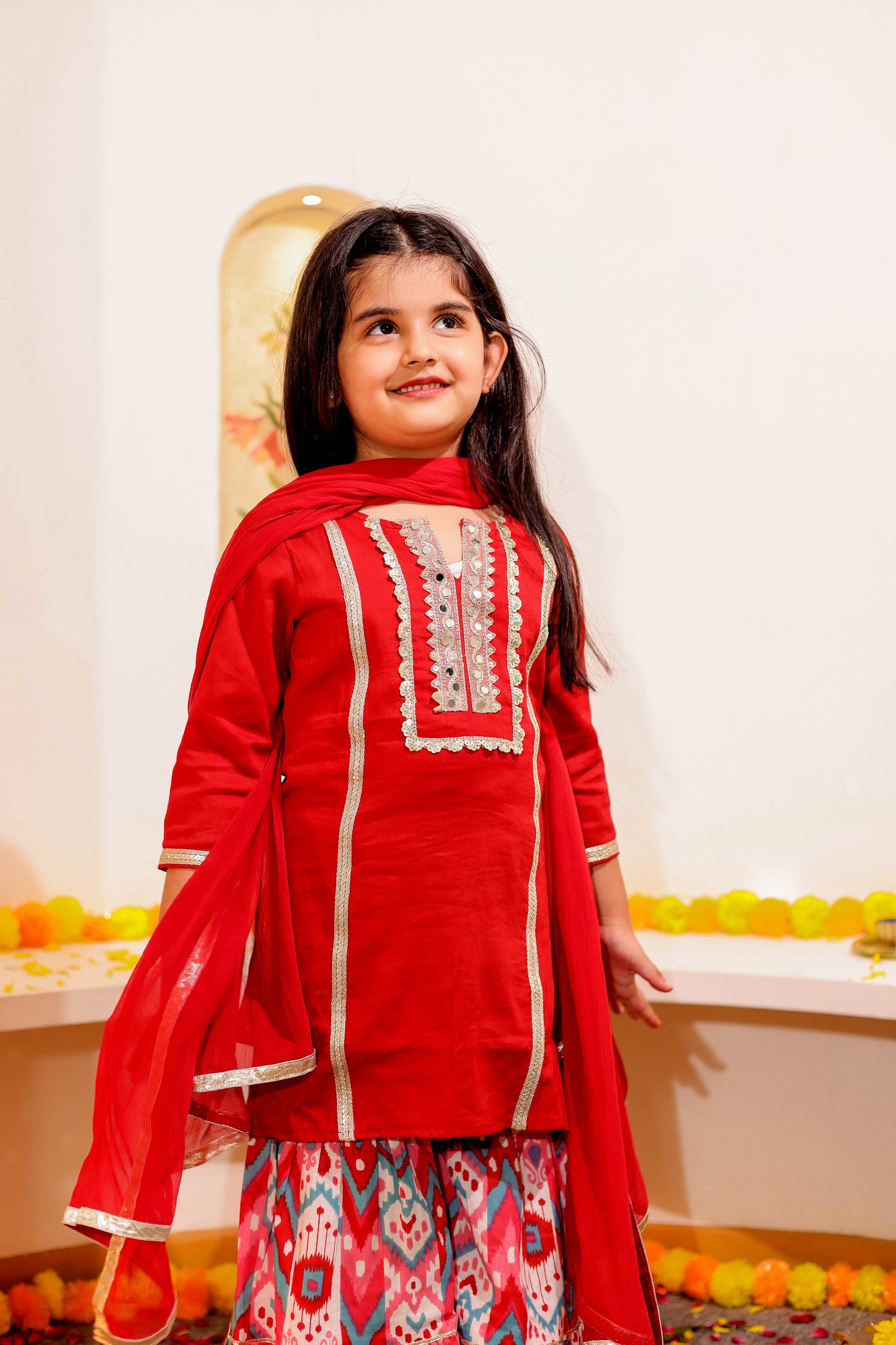 Gulnaar Grace - Girls Red Cotton Silk Kurti paired with Ikat printed Sharara and Dupatta