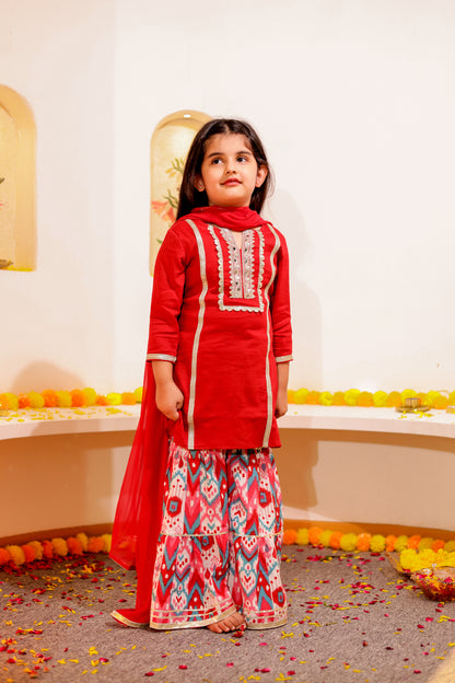 Gulnaar Grace - Girls Red Cotton Silk Kurti paired with Ikat printed Sharara and Dupatta