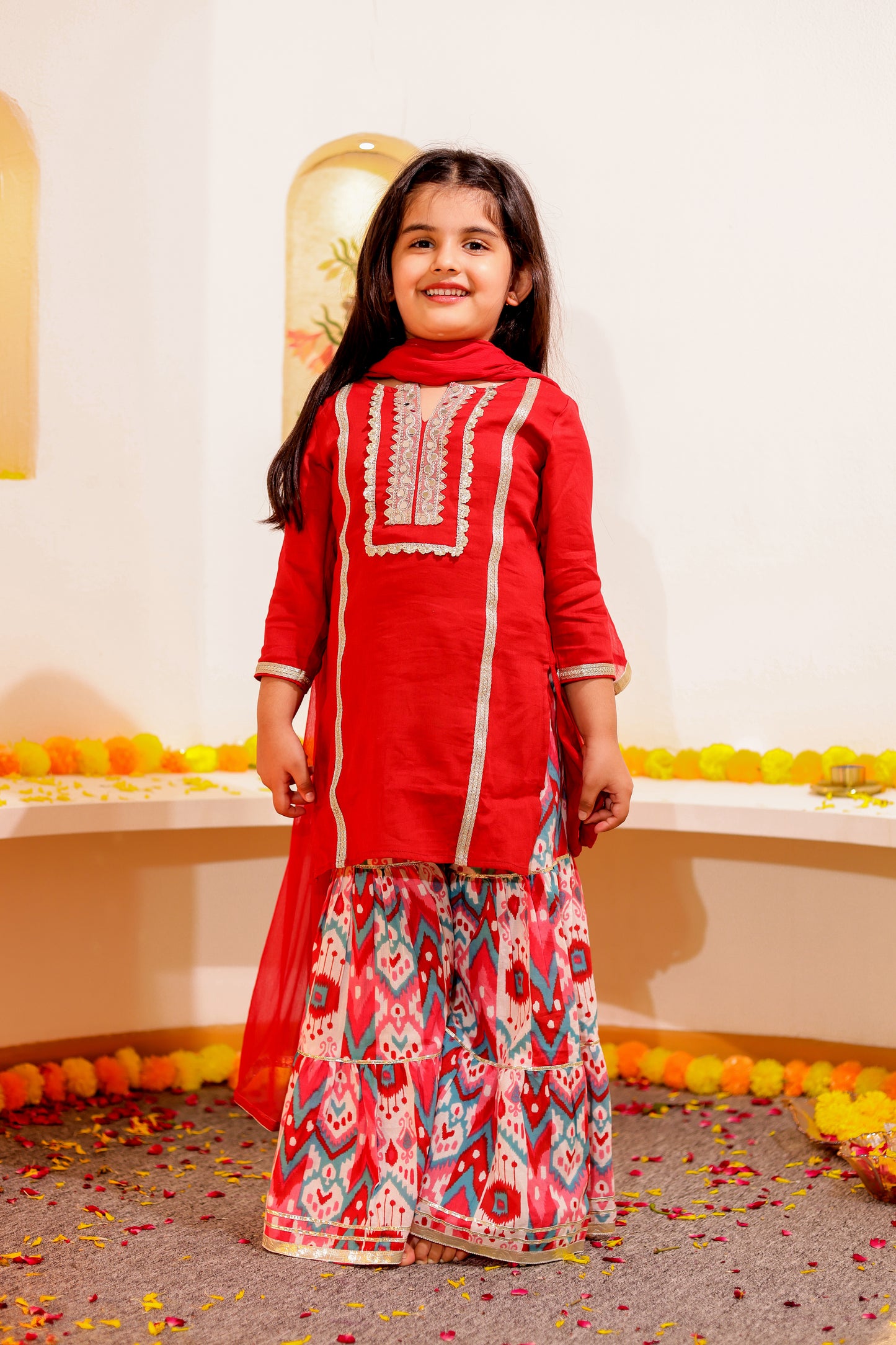 Gulnaar Grace - Girls Red Cotton Silk Kurti paired with Ikat printed Sharara and Dupatta