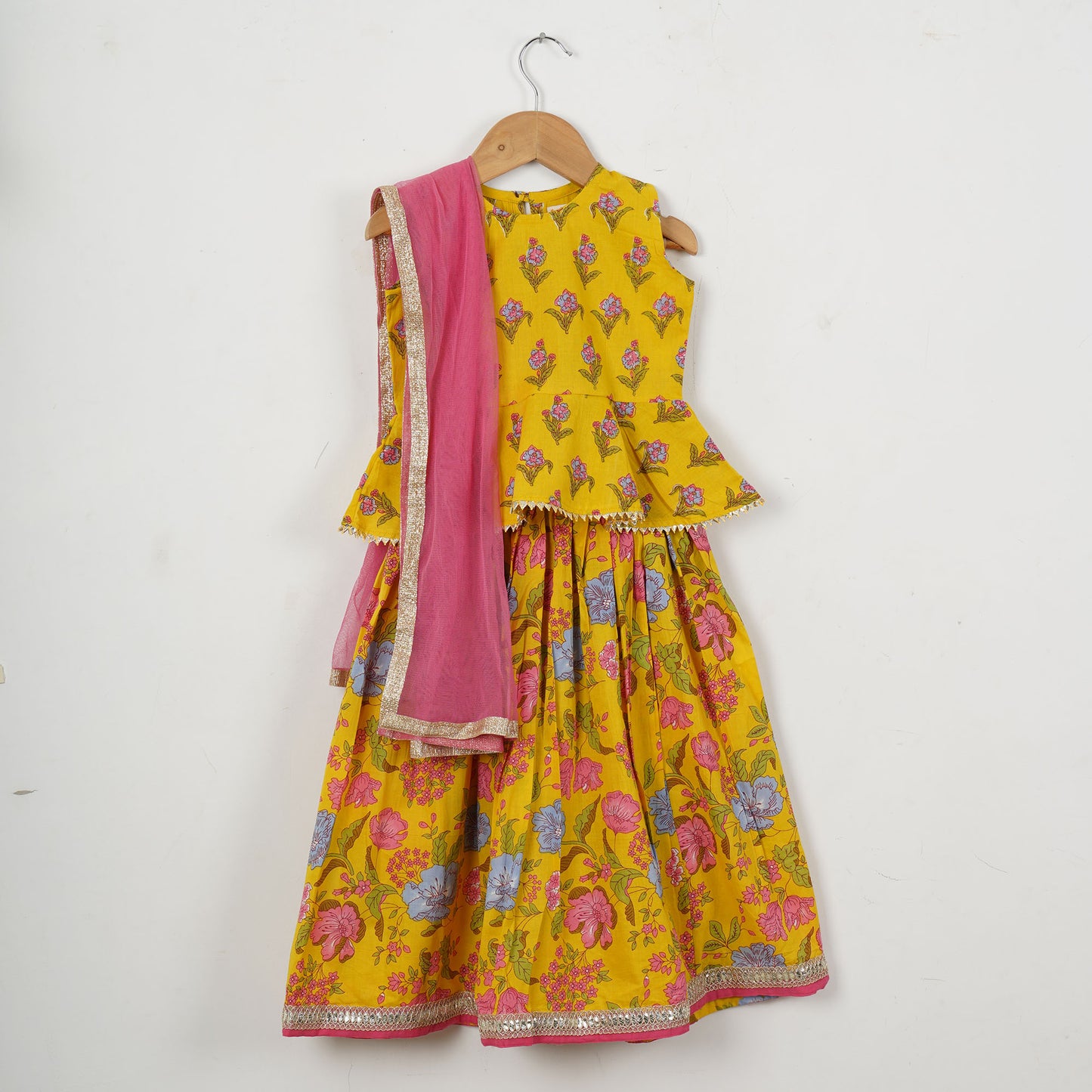 Girls Yellow Peplum Top With Yellow Floral Lehenga And Dupatta